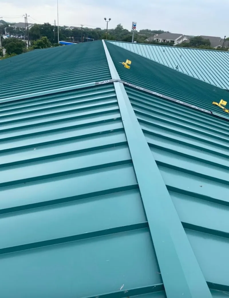Green commercial metal roof ridge and valley for Metal Roof Repair in Ormond-by-the-Sea